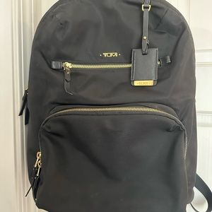 Black Tumi Backpack with gold hardware